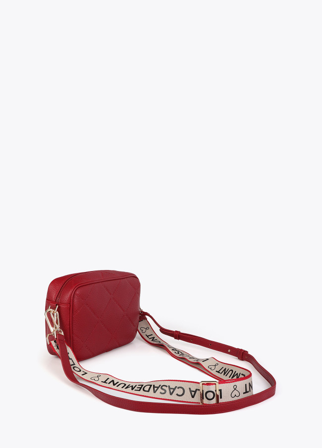 Faux leather crossbody bag with diamond design...