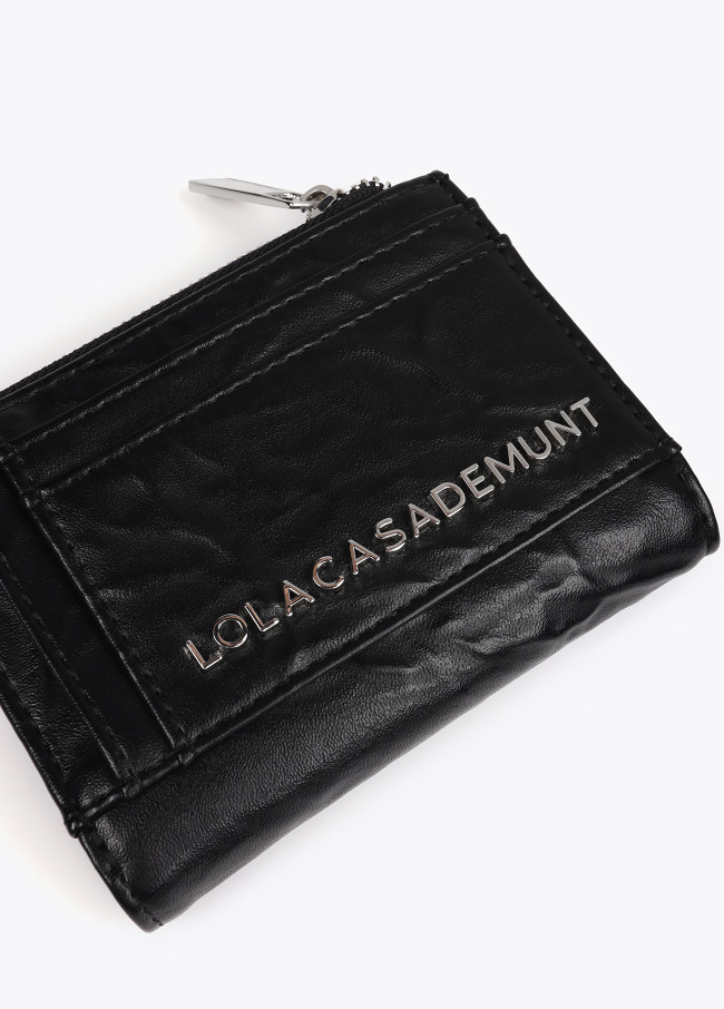 Wrinkled faux leather purse with XL studs