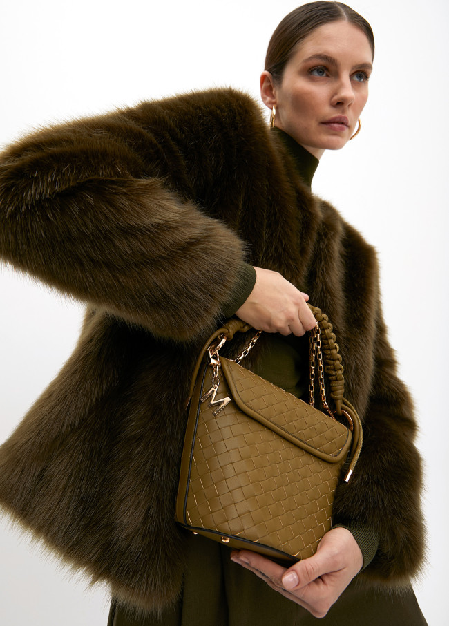 Crossbody bag with flap in braided faux leather...