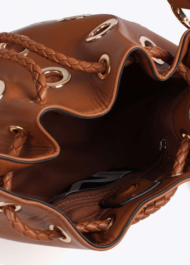 Pouch bag with circular metallic eyelets