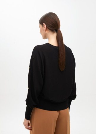 Maglione con occhielli manica cadente