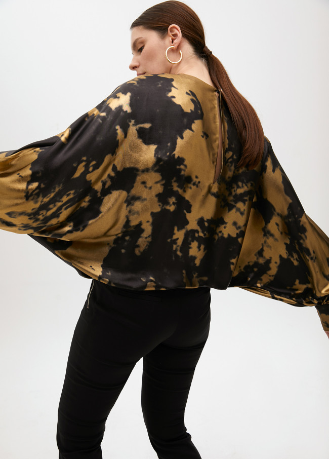 Printed blouse with asymmetric sleeves