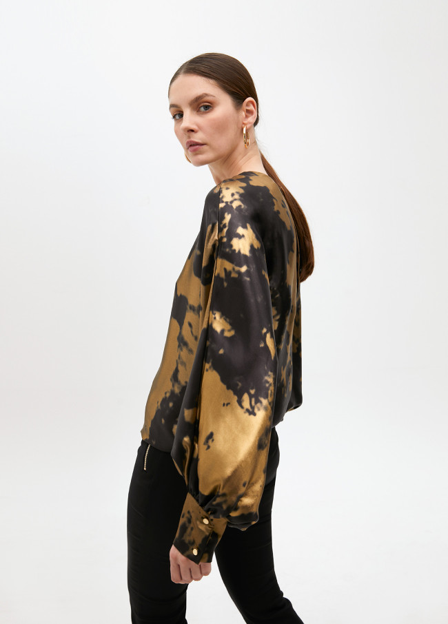 Printed blouse with asymmetric sleeves