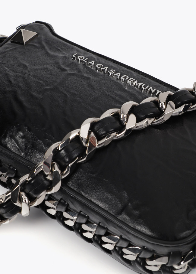 Wrinkled faux leather bag with metal details...