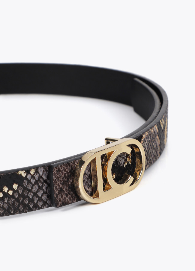 Pack of reversible animal print belts with...
