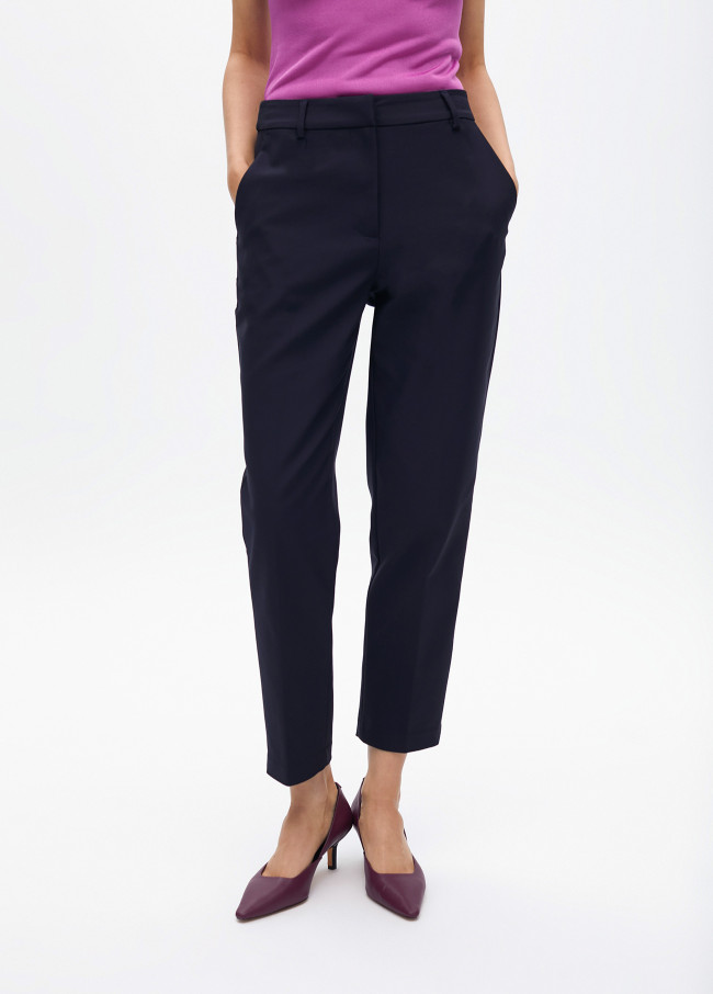 Stretchy chinos with rhinestone logos