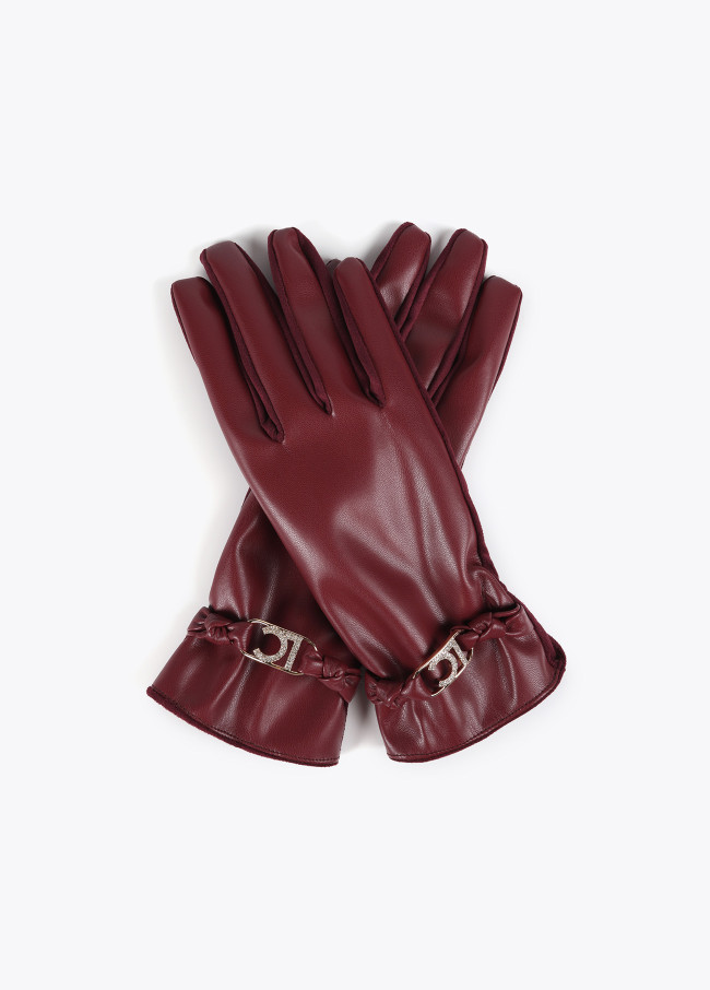 Faux leather gloves with wrist strap with oval...
