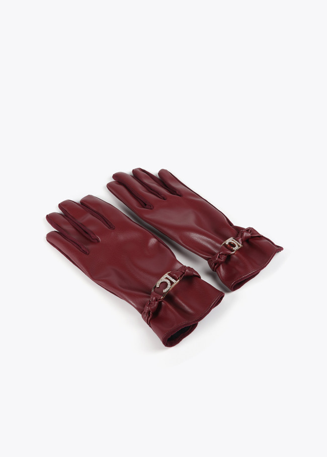 Faux leather gloves with wrist strap with oval...