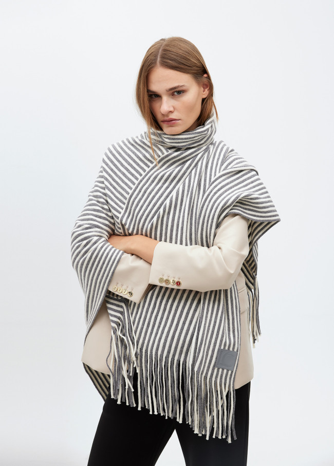 Poncho with striped knit collar