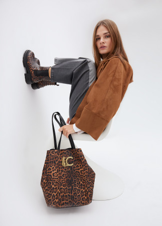 Animal print ankle boots with track sole and strap with metal details