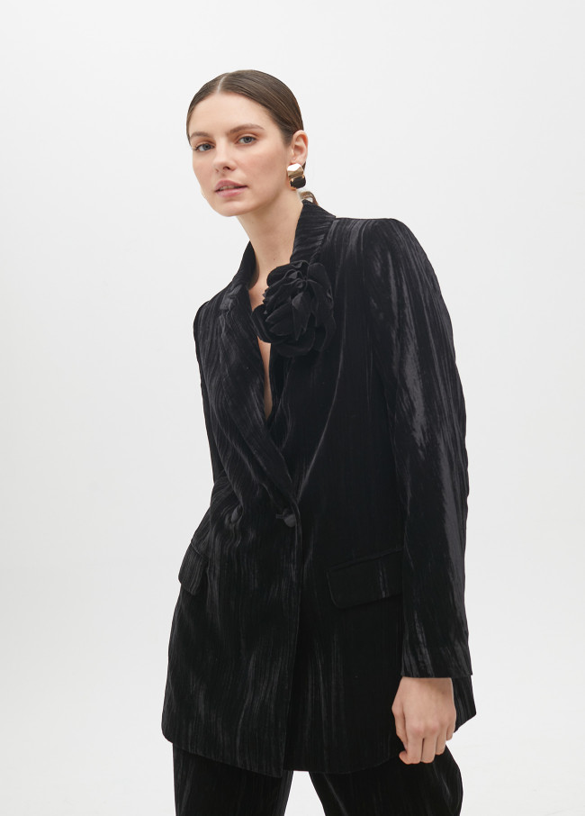 Veste en velours avec fleur sur le revers