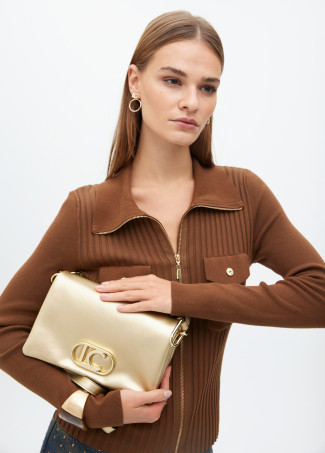 Faux leather crossbody bag with three compartments and flap.