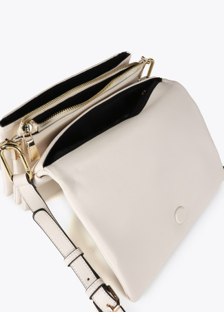 Faux leather crossbody bag with three compartments and flap.
