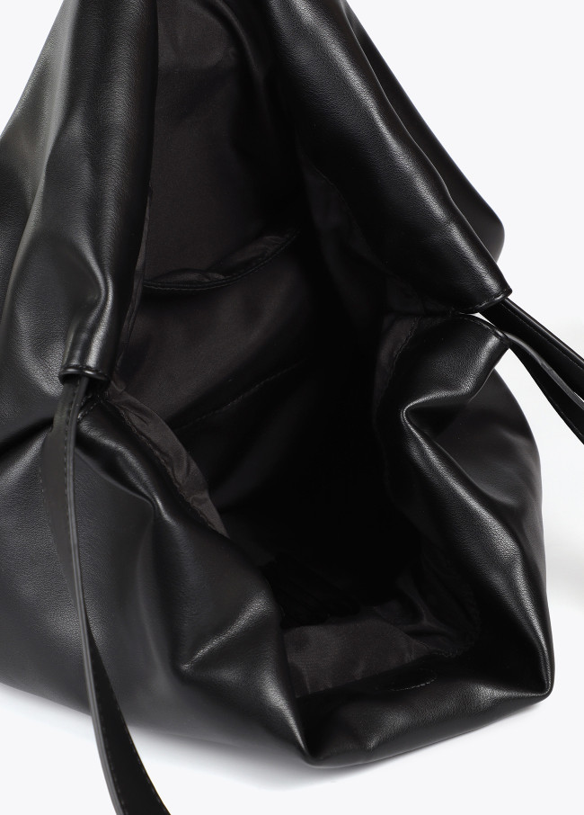 Faux leather tote bag with oval LC logo.