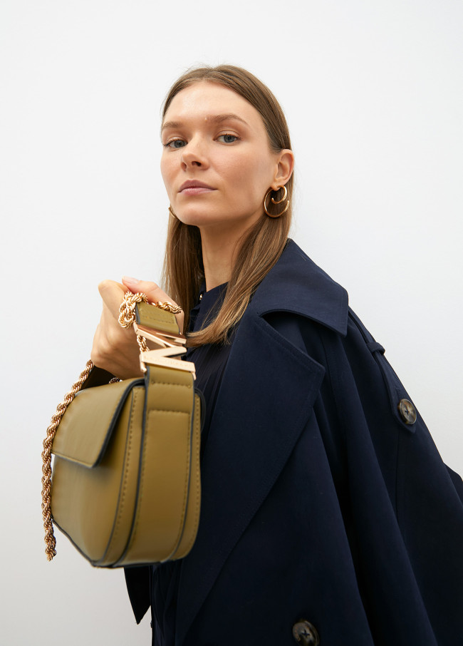 Crossbody bag with faux leather flap and M logo...