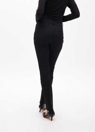 Stretch fabric trousers with zipped pocket