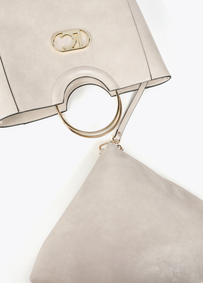 Faux leather tote bag with round metal strap...