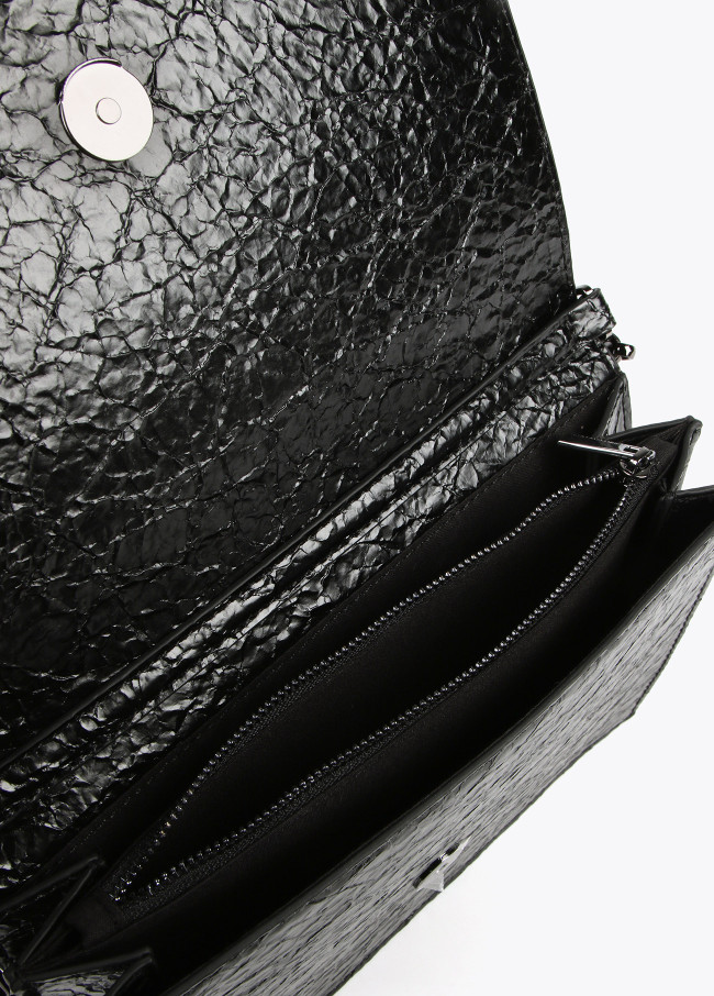 Crossbody bag with shiny faux leather flap and...