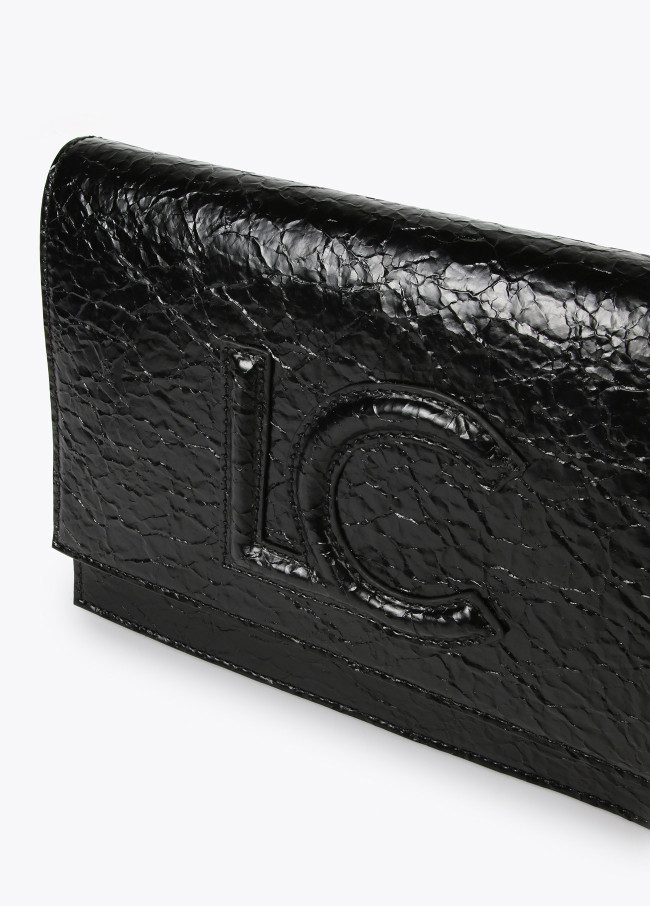 Crossbody bag with shiny faux leather flap and...