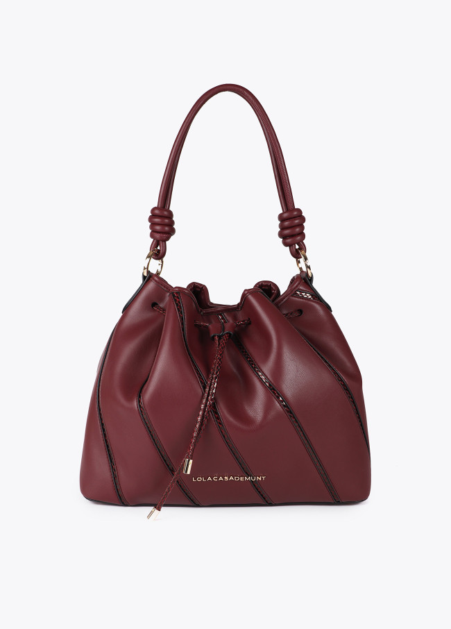 Bolso judas piezas y detalles en efecto piel...