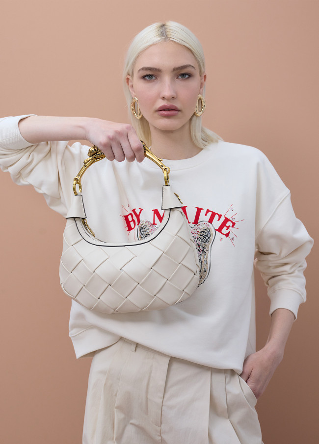 Bolso trenzado media luna asa leopardo