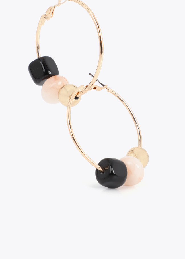 Boucles d'oreilles créoles avec détails en...