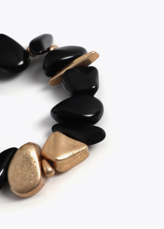 Bracciale elastico con pezzi metallici