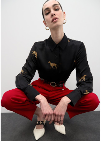 Belt with Logo-Stamped Studs and Metallic Applications.