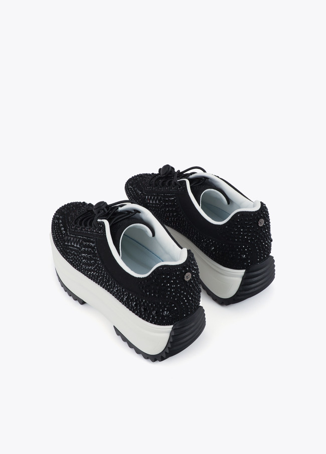 Trainers with transparent sole and rhinestone...