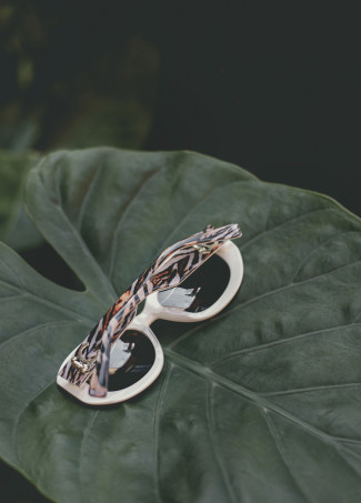 Runde Sonnenbrille mit Leoparden-Logo