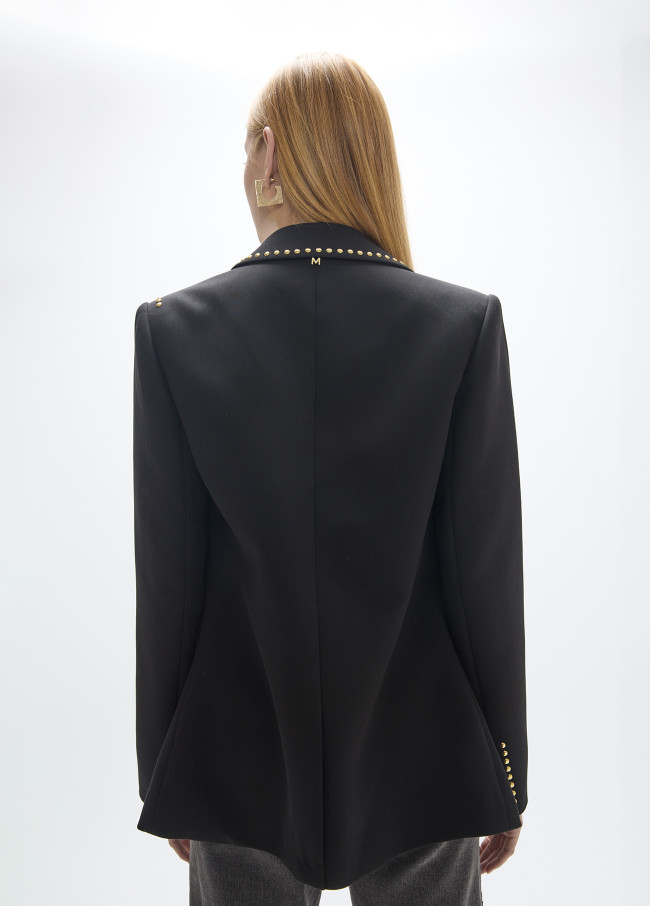 Blazer con file di borchie e immagini