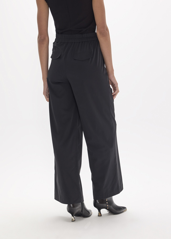 Pantaloni tecnici lunghi con cinturino borchiato