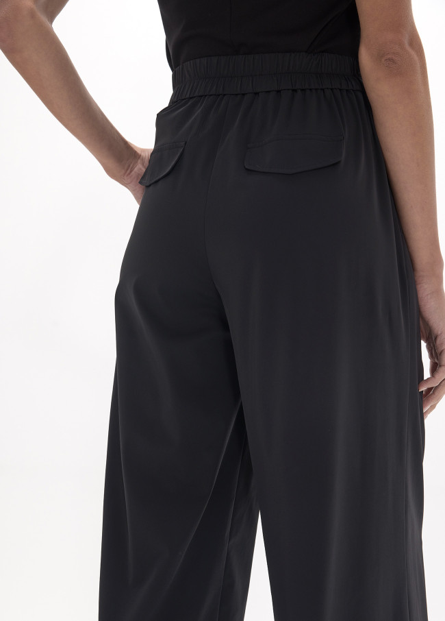 Pantaloni tecnici lunghi con cinturino borchiato