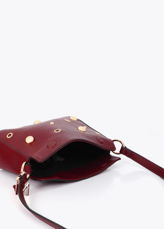Bandolera efecto piel multi tachas
