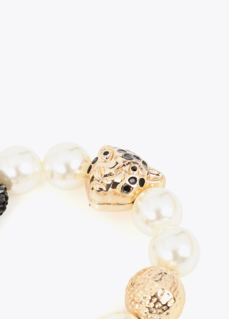 Pulsera perlas y charms